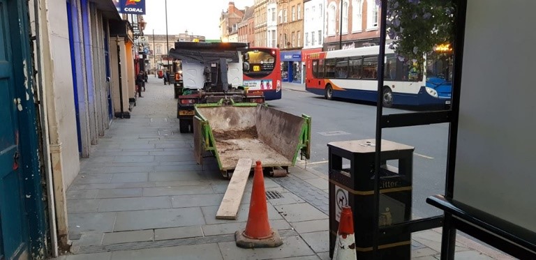 Skip being unloaded in town centre